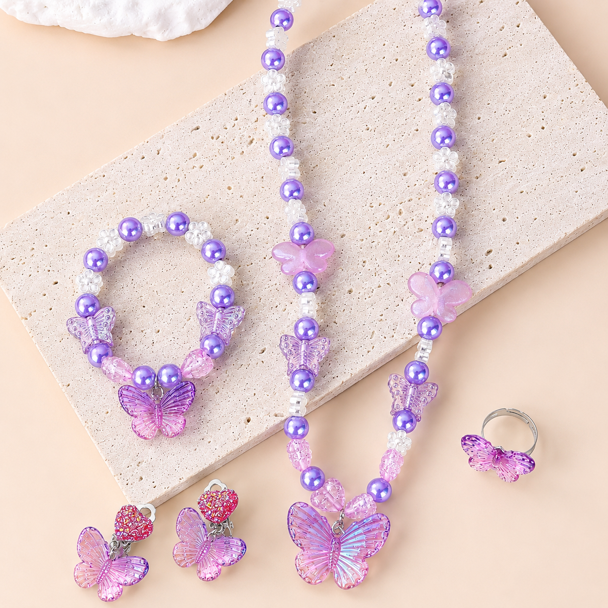 Princess butterfly jewellery set including necklace, bracelet, earrings and ring with purple pearl details for girls.