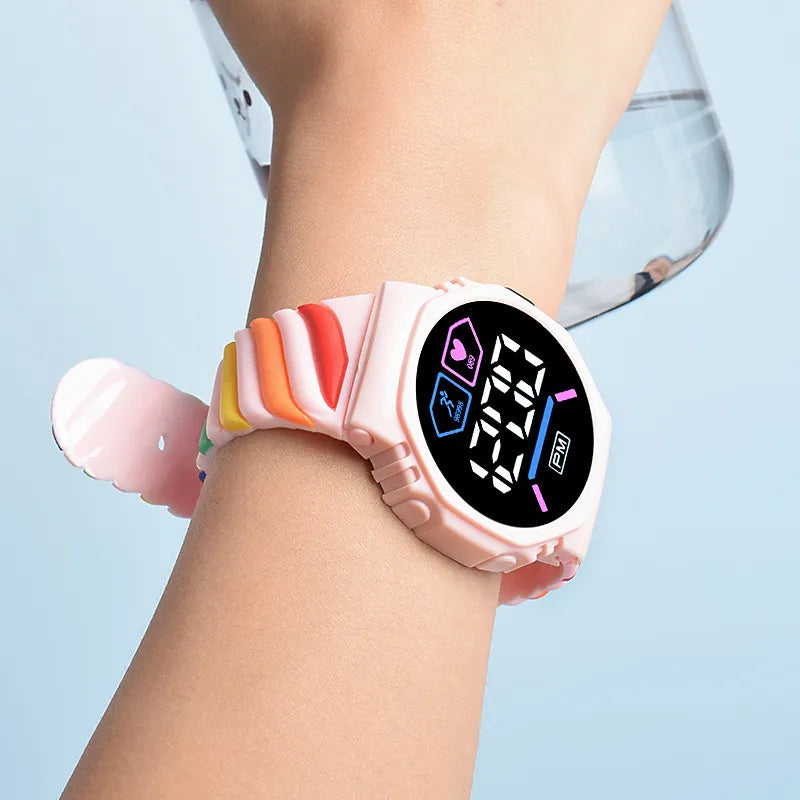 Radiant Rainbows: Kids LED Watch - Vibrant Rainbow Silicone Strap, Waterproof Sports Digital Timepiece for Boys and Girls!