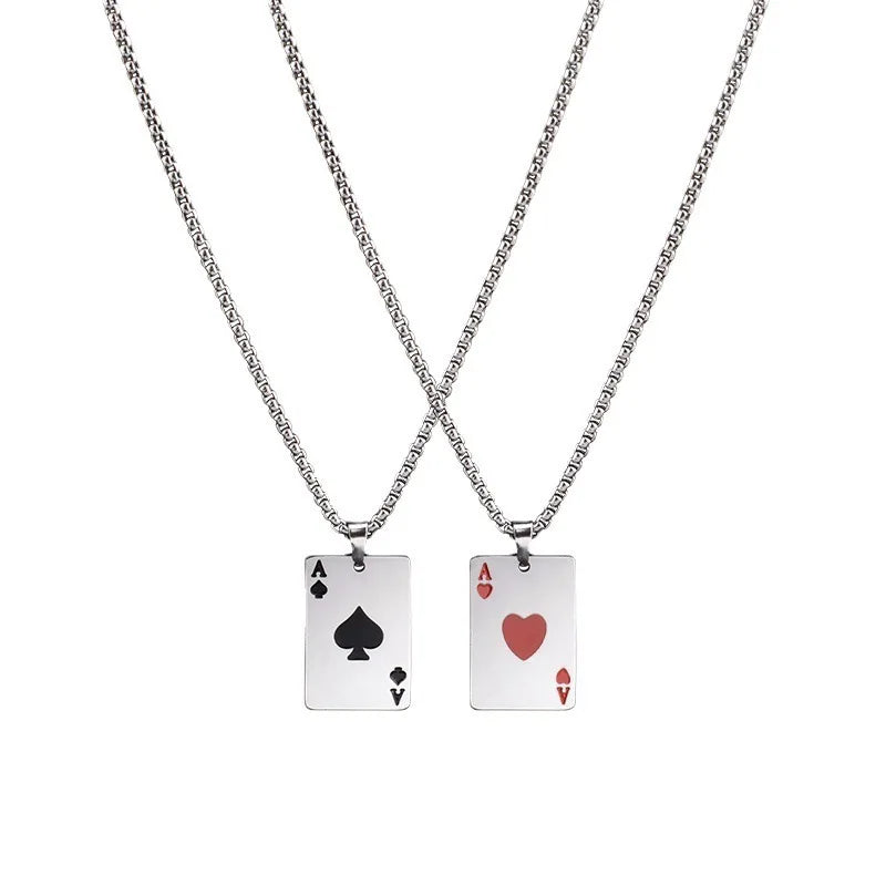 Two silver necklaces with rectangular pendant playing cards on a white background. One pendant is an Ace of Spades with a black spade symbol, and the other is an Ace of Hearts with a red heart symbol.