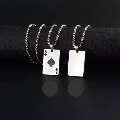 A silver necklace with an Ace of Spades playing card pendant, shown from both front and back views on a black background. The front view displays the black spade symbol and Ace of Spades lettering, while the back view shows a blank polished silver surface.