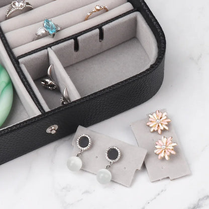 Travel in Style: Portable Button Leather Jewelry Storage Box!