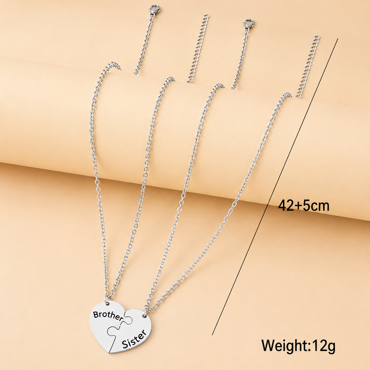 Two-piece brother and sister necklace set with matching heart puzzle design.