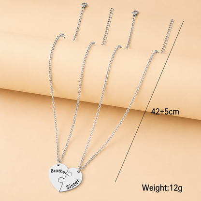 Two-piece brother and sister necklace set with matching heart puzzle design.