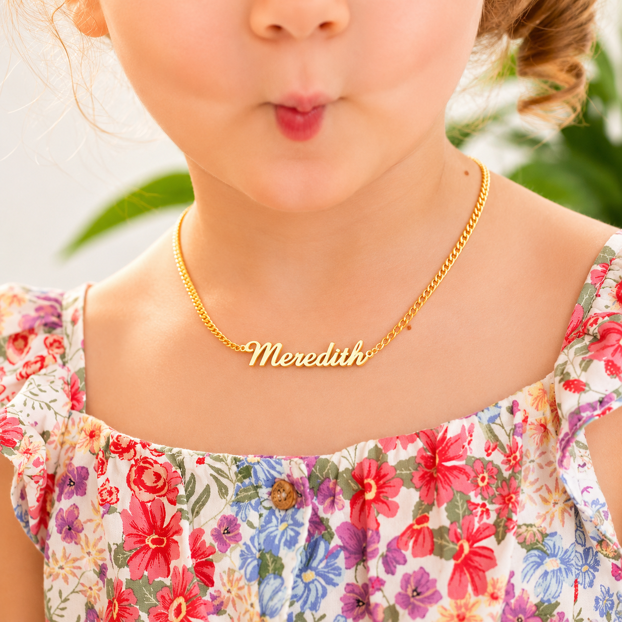 Child wearing personalized kids nameplate necklace