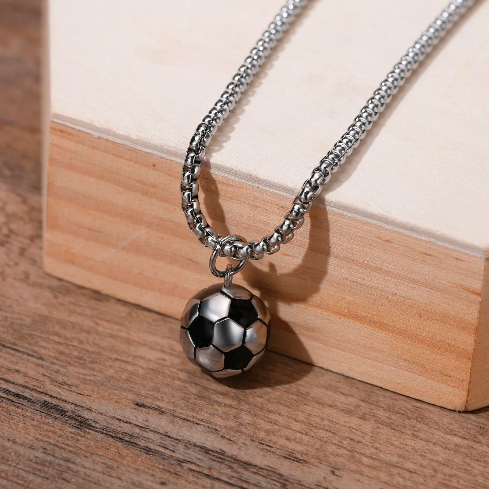 Durable sports necklace featuring a realistic football pendant.