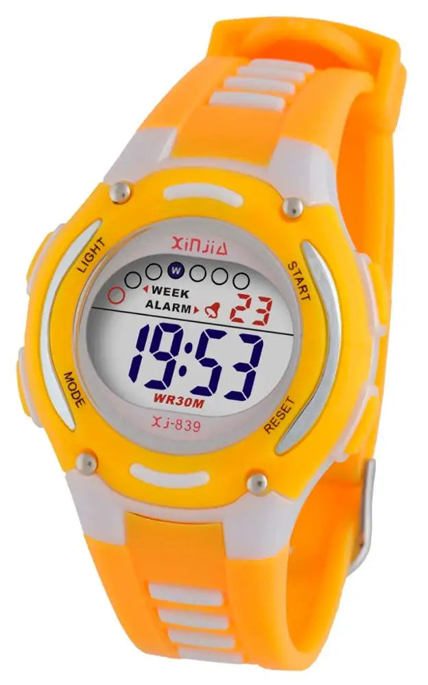 Boy wearing unisex digital sports watch during outdoor play.