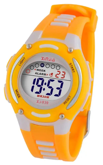 Boy wearing unisex digital sports watch during outdoor play.
